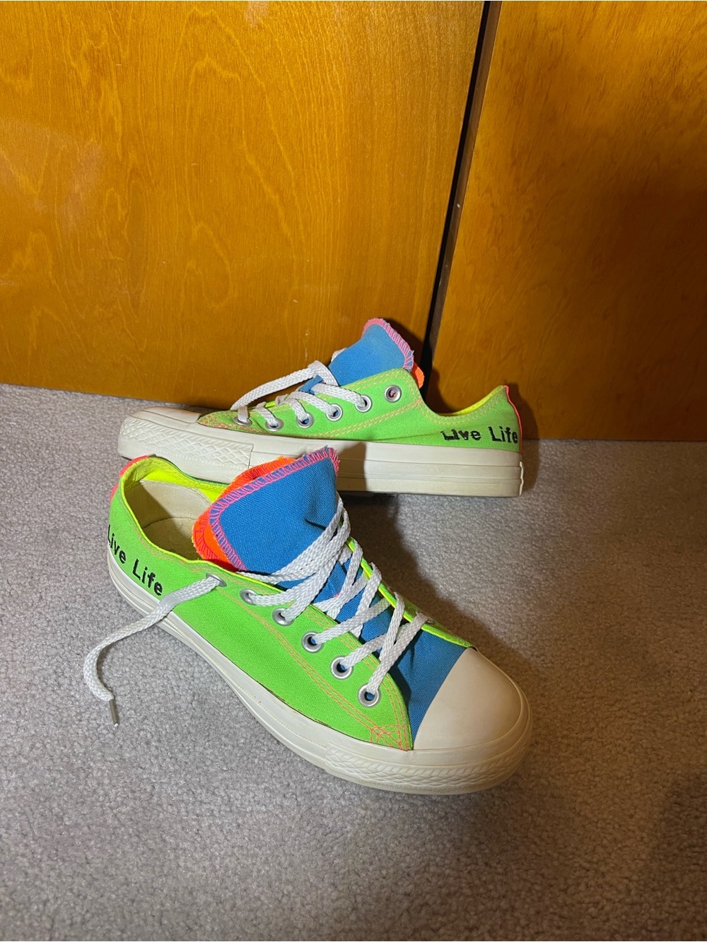 Neon Converse All-Star double tongue sneakers
Unisex men’s five women’s seven